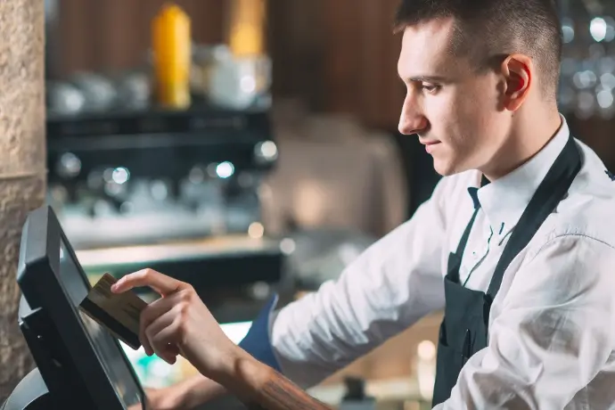Reliable POS devices for cafés and restaurants – Odoo-compatible and field-tested Waiter using touchscreen POS terminal in a hospitality environment